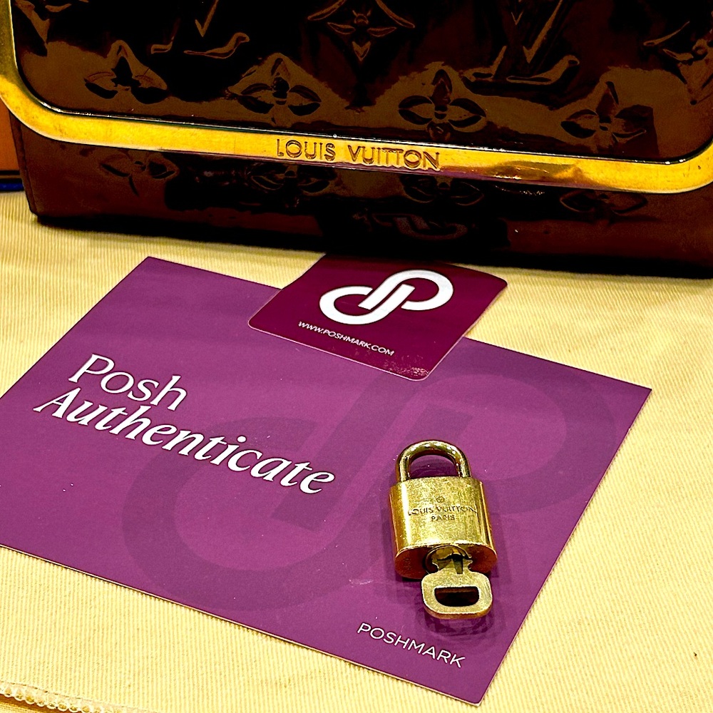 #454 Louis Vuitton Authenticated Brass Padlock Set
